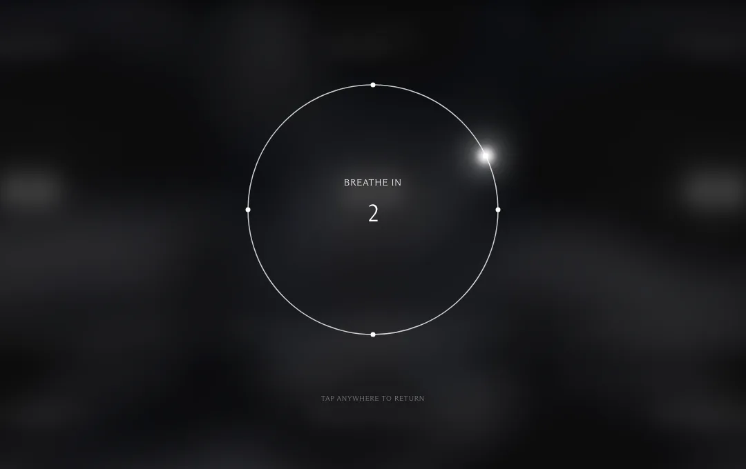 The page dimmed around a breathing circle that reads Breathe in, two, with Tap anywhere to return below it.